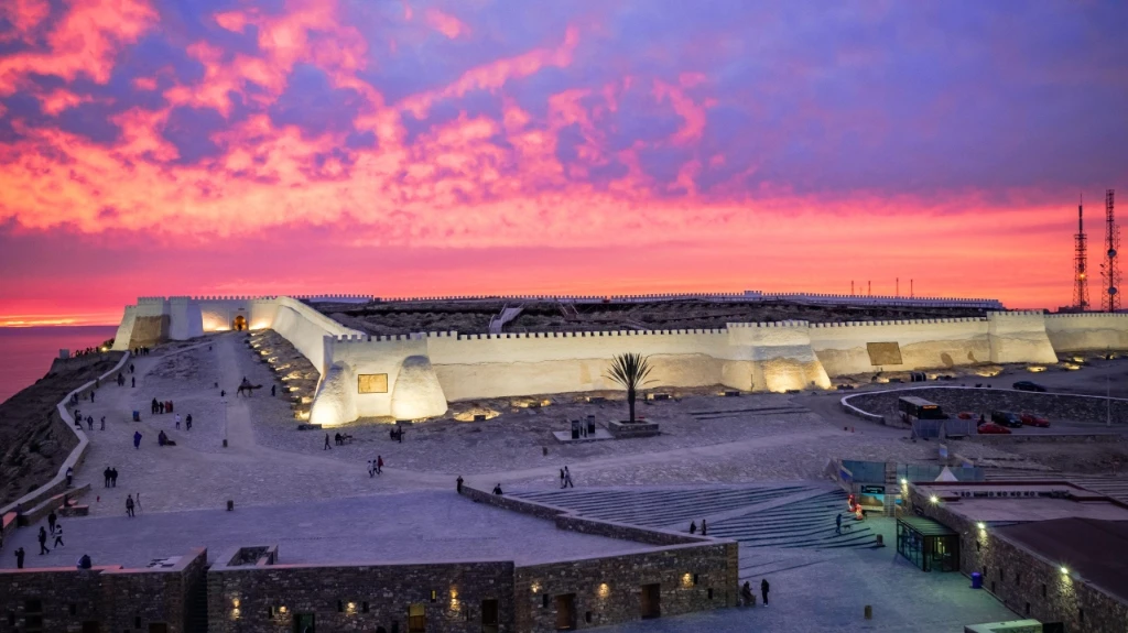 Kasbah Agadir Oufella fortress walls under a vibrant sunset sky